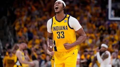 Indiana Pacers center Myles Turner celebrates at the end of Game 3 against the New York Knicks in an NBA basketball second-round playoff series, Friday, May 10, 2024, in Indianapolis. The Pacers won 111-106. (AP Photo/Michael Conroy)