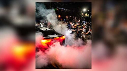 A large crowd gathers to watch cars do burnouts in Atlanta. Authorities are looking for ways to crack down on the recent spike in illegal street racing across the city. (Photo courtesy of Ben Hendren)
