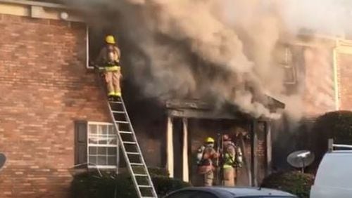 Cobb County firefighters battled a blaze Thursday at apartments near Smyrna.