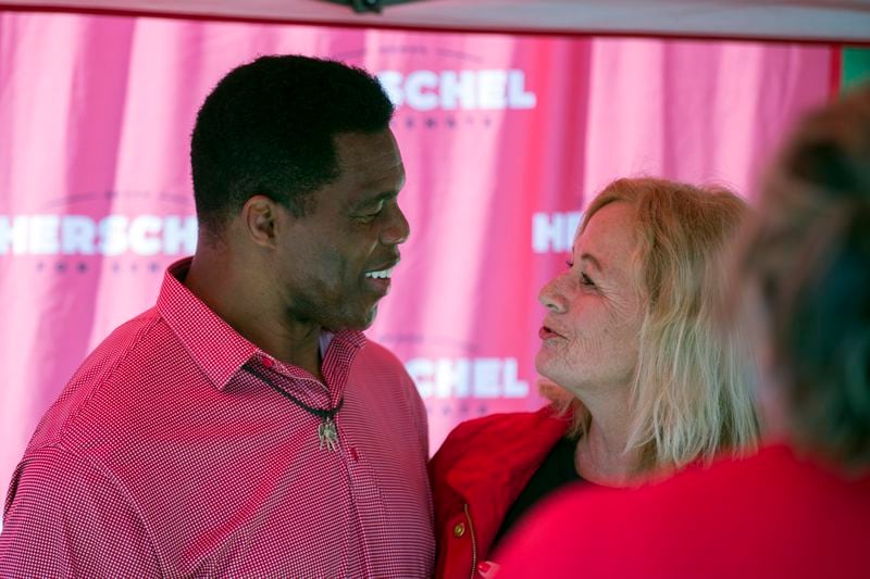 Georgia Republican Senate candidate Herschel Walker takes time to take a photo with Jeanne Seaver during a Unite Georgia Bus Stop Tour, Saturday, Oct. 15, 2022, in Savannah. (Photo: Stephen B. Morton for The Atlanta Journal-Constitution)