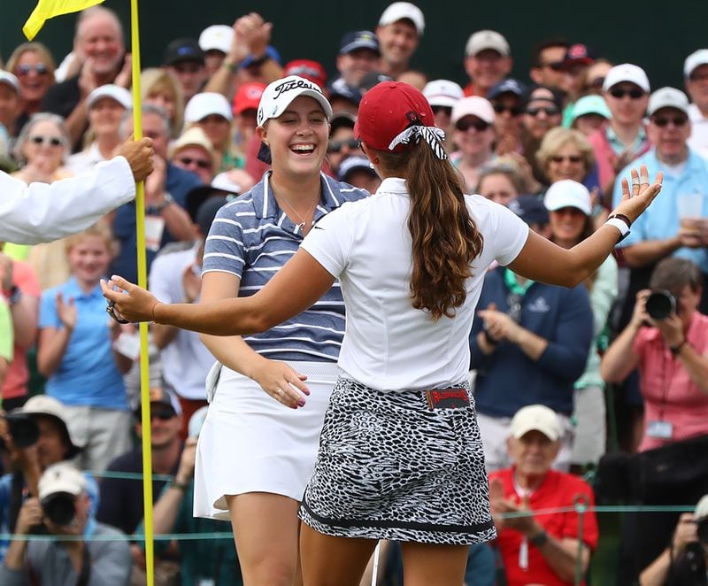 Augusta National Women's Amateur winner Jennifer Kupcho (left) gets ready to hug it out with runner-up Maria Fassi  on No. 18. (Curtis Compton/ccompton@ajc.com)