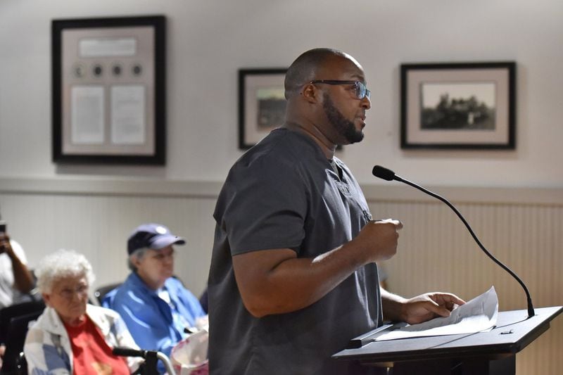 Shantwon Astin expresses his concern during public hearing and regular meeting at Hoschton Train Depot in Hoschton on Thursday, May 30, 2019. Mayor Theresa Kenerly and Councilman Jim Cleveland have been under fire for comments regarding the handling of a black candidate for city administrator in March. ‘Do the right thing so this city can move on,’ Astin told the two. HYOSUB SHIN / HSHIN@AJC.COM