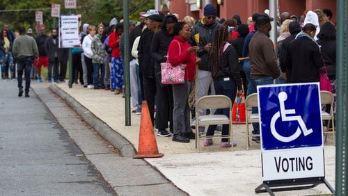 People wait in a long line to vote Saturday at the Cobb County Board of Elections and Registration office in Marietta, GA October 27, 2018. STEVE SCHAEFER / SPECIAL TO THE AJC