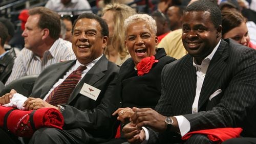 Atlanta's then-mayor Shirley Franklin (center) enjoys the Atlanta Hawks home opener at Philips Arena on November 8, 2005, while seated next to former mayor Andrew Young (left) and then-state-senator Kasim Reed, who served as Franklin's campaign manager. (Brant Sanderlin / AJC file)
