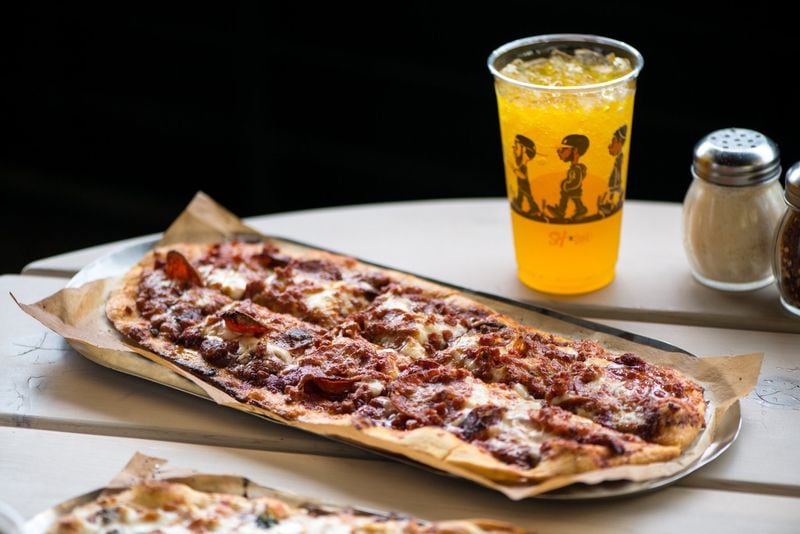 Slim and Husky's Rony, Roni, Rone! pizza with classic red sauce, house cheese blend, pork pepperoni, beef pepperoni, spiced pepperoni and Hibiscus Orange Stubborn Soda. Photo credit- Mia Yakel.