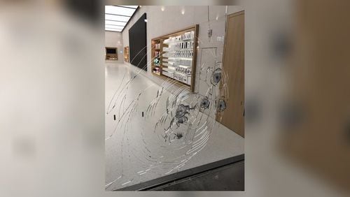 Alpharetta police are searching for thieves they say cracked the glass of an Apple store. (Credit: Channel 2 Action News)