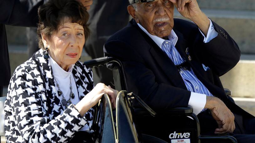 The Rev. Joseph Lowery, former president of the Southern Christian Leadership Conference, and his wife Evelyn Lowery look out at the crowd at a rally to commemorate the 50th anniversary of the 1963 March on Washington on the steps of the Lincoln Memorial on Aug. 24, 2013, in Washington.