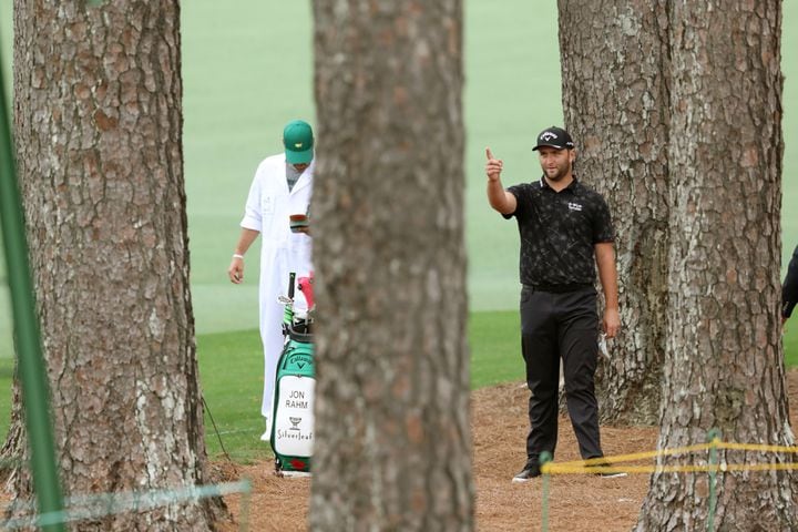 April 10, 2021, Augusta: Jon Rahm prepares to hit in the woods off of the second fairway during the third round of the Masters at Augusta National Golf Club on Saturday, April 10, 2021, in Augusta. Curtis Compton/ccompton@ajc.com