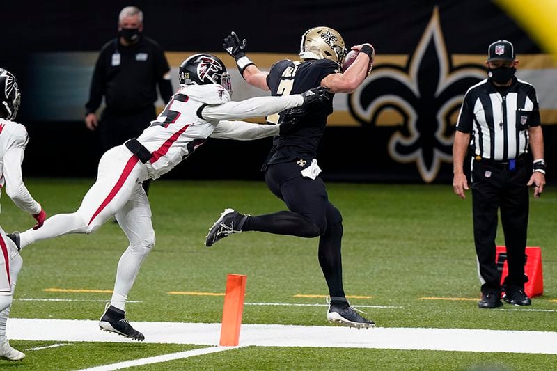 Saints quarterback Taysom Hill (7) enters the end zone for a touchdown just out of the reach of Falcons linebacker Deion Jones (45) in the second half Sunday, Nov. 22, 2020, in New Orleans. (Butch Dill/AP)