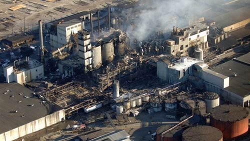 Firefighters fight a blaze Feb. 8, 2008, at the Imperial Sugar Company after an explosion Thursday night ripped apart the plant on the Savannah River in Port Wentworth, Ga. The blast killed 14 people and injured dozens more. (AP Photo/Stephen Morton)