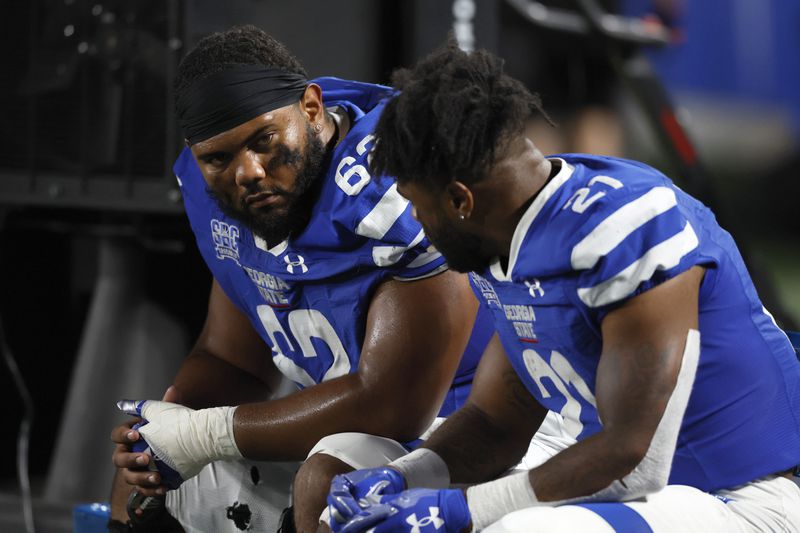Panthers center Malik Sumter (62) talks with running back Jamyest Williams during the closing minutes of their loss to the Chanticleers on Sept. 22 at Center Parc Stadium. (Jason Getz / Jason.Getz@ajc.com)