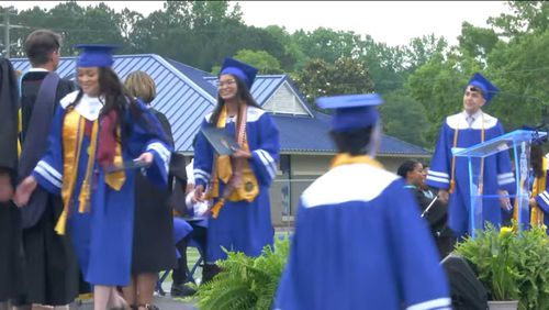 Students from McEachern High School in Cobb County receive their diplomas during the 2024 graduation ceremony. (Courtesy of Cobb County School District)