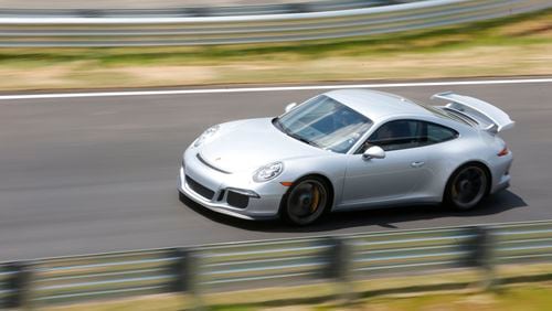 The Porsche Experience includes rides on their test track. BOB ANDRES / BANDRES@AJC.COM