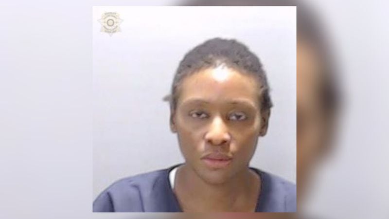 Raissa Kengne, 34, was arrested Monday on murder and other charges in a series of shootings in Midtown Atlanta. Two men were killed, and a third man was injured.