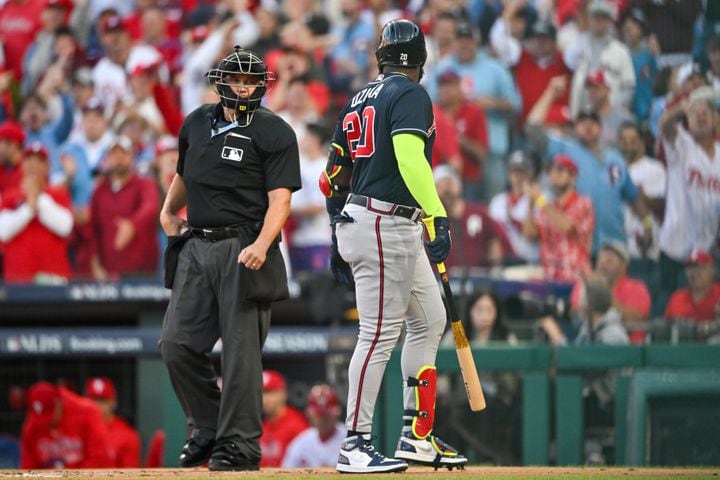 Atlanta Braves’ Marcell Ozuna (20) strikes out against the Philadelphia Phillies and has a word with home plate umpire Mark Carlson to end the first inning of NLDS Game 3 in Philadelphia on Wednesday, Oct. 11, 2023.   (Hyosub Shin / Hyosub.Shin@ajc.com)