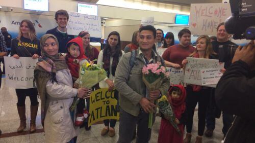 Wali Omari and his wife Parwana, along with their five-year-old daughter and three-year-old son landed at Hartsfield Jackson International-Airport just before midnight. Photo Ellen Eldridge