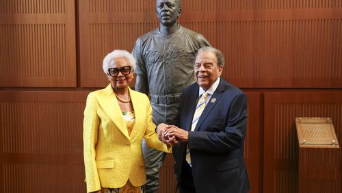 Billye Aaron, Hank Aaron’s widow, stands next to Ambassador Andrew Young for a photograph in front of the new Hank Aaron statue by the grand staircase at the National Baseball Hall of Fame, Thursday, May 23, 2024, in Cooperstown, NY. (Jason Getz / AJC)
