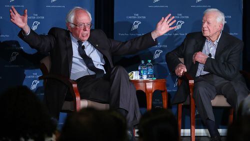 Former President Jimmy Carter and U.S. Sen. Bernie Sanders discuss human rights at the Carter Center on Monday. Curtis Compton, ccompton@ajc.com