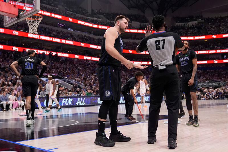 Dallas Mavericks' Luka Doncic talks to referee Mitchell Ervin (27) before being issued a technical foul by Ervin in the first half of Game 6 of an NBA basketball second-round playoff series Saturday, May 18, 2024, in Dallas. (AP Photo/Tony Gutierrez)
