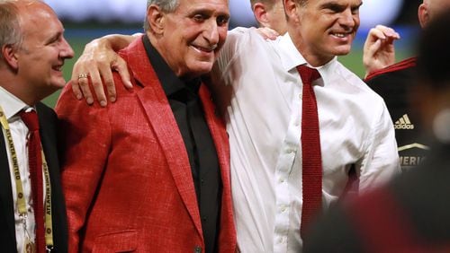 Atlanta United and Atlanta Falcons owner Arthur Blank and head coach Frank de Boer share a hug as they celebrate defeating Minnesota United 2-1 to win the U.S. Open Cup on Tuesday, August 27, 2019, in Atlanta.  Curtis Compton/ccompton@ajc.com