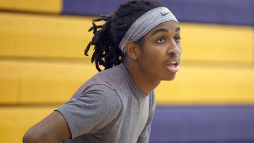 Eagle’s Landing High School sophomore Christian Spencer takes a break during practices on the JV basketball team, Wednesday, December 21, 2022, in McDonough, Ga.. Spencer, who has autism, overcame the odds to earn a spot on the Eagle’s Landing JV basketball team. (Jason Getz / Jason.Getz@ajc.com)