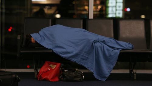 2/4/19 - Atlanta - Passengers spend the night at the airport after the Super Bowl. Delta Airlines handed out blankets and pillows to passengers spending the night in the airport instead of getting a hotel room. EMILY HANEY / emily.haney@ajc.com