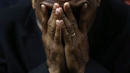 Mourners bow their heads in prayer during the funeral for the Rev. Clementa Pinckney, who was killed along with eight others in a mass shooting at Emanuel AME Churchin Charleston. (Photo by Win McNamee/Getty Images)