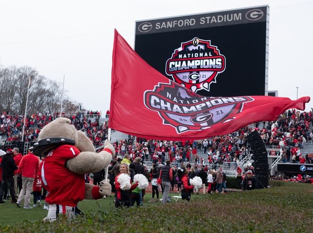 220115-Athens-Hairy Dawg waves a championship flag following the National Championship celebration Saturday afternoon, Jan. 15, 2022, in Athens. Ben Gray for the Atlanta Journal-Constitution