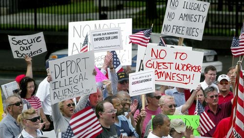 Protesters gathered at the Georgia Capitol in downtown Atlanta in April 2006 to call for legislation restricting unauthorized immigrants. (JOHN SPINK/AJC staff)