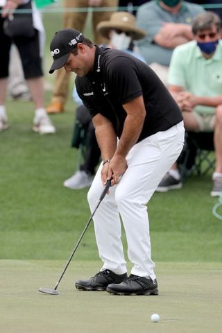 April 8, 2021, Augusta: Patrick Reed reacts to missing his par putt on the eighteenth green during the first round of the Masters at Augusta National Golf Club on Thursday, April 8, 2021, in Augusta. Curtis Compton/ccompton@ajc.com