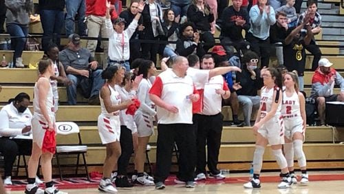 Coach John Zorn directs the Loganville girls in the final minute of their Class 5A playoff win against Maynard Jackson.
