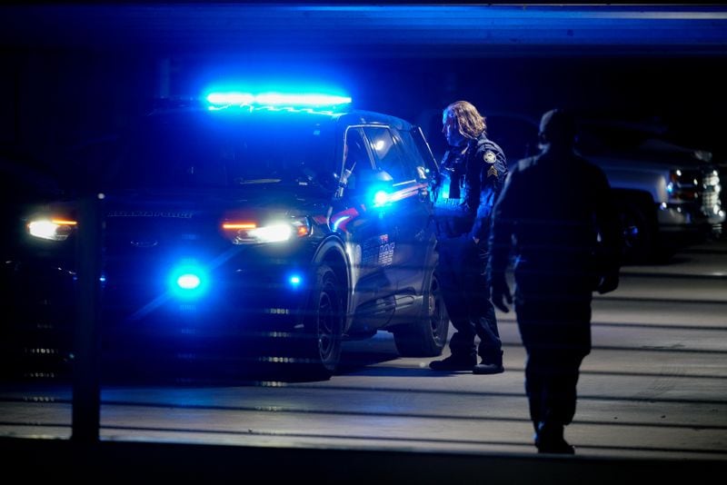Atlanta police officers work the scene of a shooting Thursday night at the Camden Vantage Apartments.