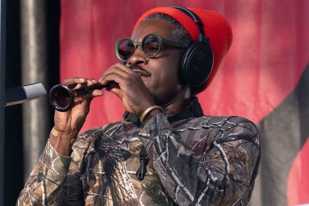 Andre 3000 plays flute onstage at the Atlanta Jazz Festival on May 27, 2024.