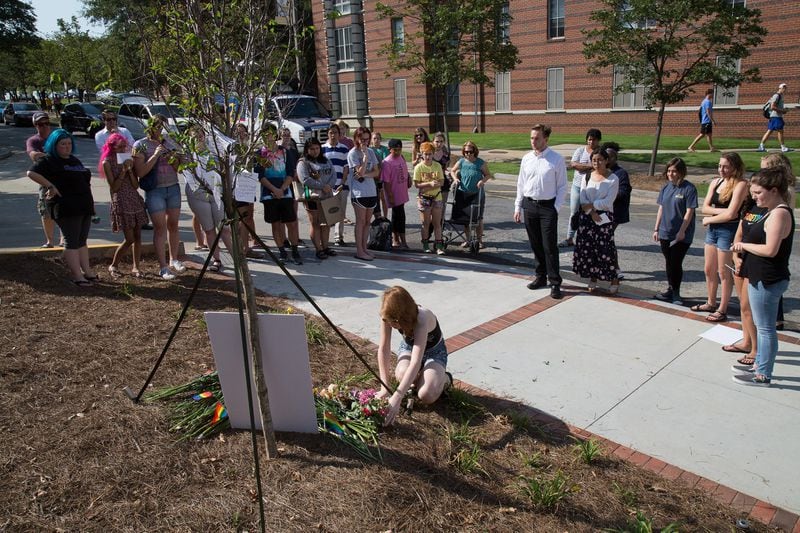 A group gathers at a memorial for Georgia Tech student Scout Schultz on Sept. 17, 2017, in Atlanta. Schultz, an engineering student at Georgia Tech, was shot by Georgia Tech campus police after allegedly wielding what looked like a knife. (STEVE SCHAEFER / SPECIAL TO THE AJC)