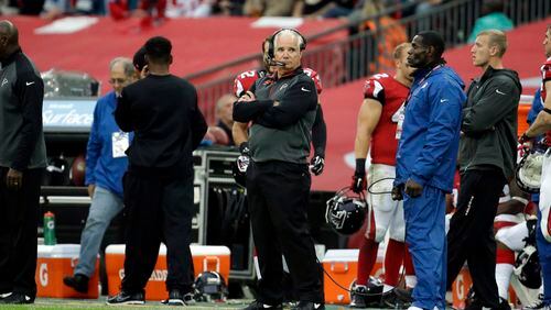 Atlanta Falcons head coach Mike Smith watches from the sideline in the second half of the NFL football game against the Detroit Lions at Wembley Stadium, London, Sunday, Oct. 26, 2014. (AP Photo/Matt Dunham) Mike Smith made some poor decisions down stretch Sunday. (AP photo)