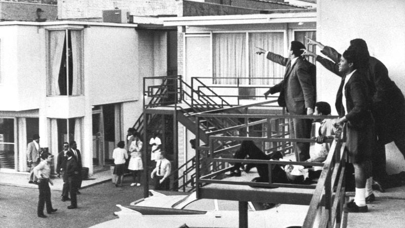 Civil rights leader Andrew Young, left, and others accompanying the Rev. Dr. Martin Luther King Jr. point police in the direction of a rifle shot that struck King, lying at their feet, in the neck as he stood on the balcony of the Lorraine Motel in Memphis the evening of April 4, 1968. King, who was in Memphis to help lead a sanitation workers' strike, died a short time later at a hospital. Mary Ellen Ford, a motel worker standing among the people on the ground below, spoke out for the first time as the nation prepares to observe the 50th anniversary of King's assassination.