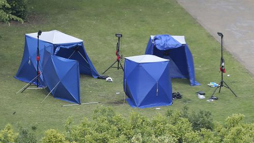 An aerial view shows police tents in Forbury Gardens at the scene of a multiple stabbing attack. A 25-year-old man believed to be the lone attacker is in custody.