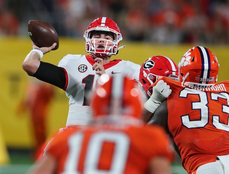 Georgia quarterback JT Daniels completes a pass against Clemson during the first quarter Saturday, Sept 4, 2021, in Charlotte, N.C. (Curtis Compton / Curtis.Compton@ajc.com)
