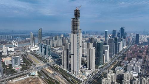 FILE - This photo released by Xinhua News Agency shows an aerial view of the construction site of the 2nd phase project of the Nanjing Financial City designed as an architectural complex comprising offices, hospitality, housing and commercial facilities in Nanjing, east China's Jiangsu Province, on Jan. 16, 2024. China was preparing to announce fresh measures to reinvigorate its ailing property industry after data released Friday, May 17, 2024 showed housing prices slumped in the first four months of the year, although factory output rose nearly 7%. (Li Bo/Xinhua via AP, File)