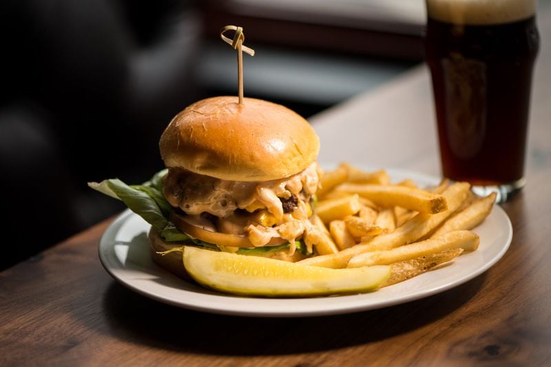 Good Word Brewing’s menu mixes Southern, Latin and local influences, but you also can get a big burger with fries. CONTRIBUTED BY MIA YAKEL
