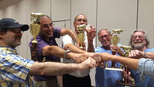 Members of kosher barbecue team Meatzvah Men gather after prepping their food at B'Nai Torah in Sandy Springs. The team competed in the fourth annual Atlanta Kosher Barbecue competition on Sept. 25. From left: Steve Kaufman, Mitch Frank, Kirk Pardue, Stan Schnitzer, Jeff Marlowe. Photo by: Ligaya Figueras