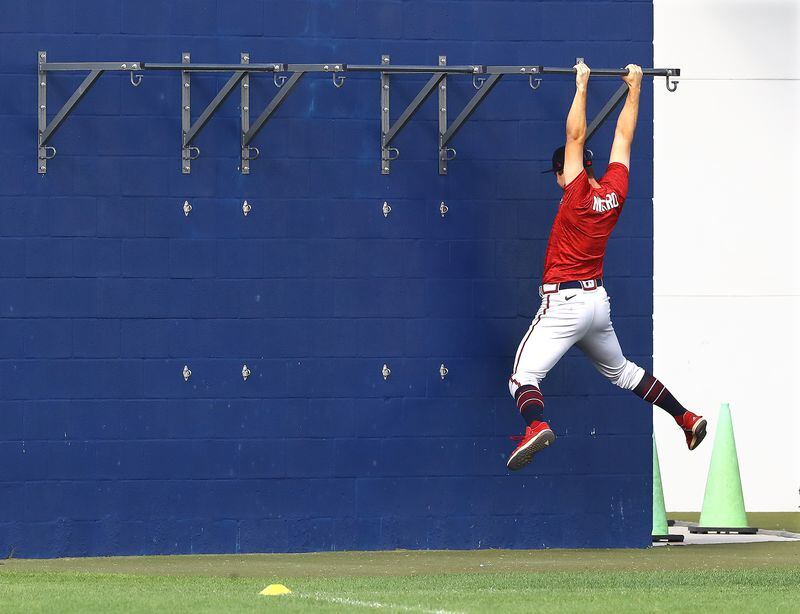 J.J. Niekro stretches outside the training room before a day of practice at the Braves minor league spring training camp on Tuesday, March 8, 2022, in North Port.  “Curtis Compton / Curtis.Compton@ajc.com”`