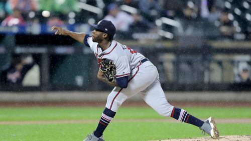NEW YORK, NY - SEPTEMBER 25:  Touki Toussaint #62 of the Atlanta Braves delivers a pitch in the first inning against the New York Mets on September 25,2018 at Citi Field in the Flushing neighborhood of the Queens borough of New York City.  (Photo by Elsa/Getty Images)
