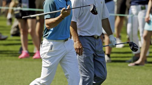 Rory McIlroy, of Northern Ireland, walks with Jeff Knox, right, down the eighth fairway during the third round of the Masters golf tournament Saturday, April 12, 2014, in Augusta, Ga. (AP Photo/Darron Cummings) Rory McIlroy walks marker Jeff Knox during his round Saturday. Knox beat him by a stroke. (AP photo)