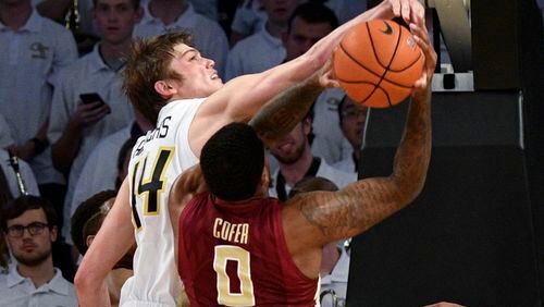 Georgia Tech center Ben Lammers gets his hand on the shot of Florida State forward Phil Cofer during the second half of an NCAA basketball game Wednesday, Jan. 25, 2017, in Atlanta. Georgia Tech won 78-56. (AP Photo/John Amis)