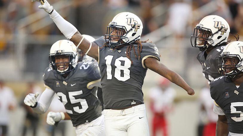 UCF linebacker Shaquem Griffin (18) celebrates after returning a fumble 20 yards for a touchdown in the second quarter against Austin Peay on Saturday, Oct. 28, 2017 at Spectrum Stadium in Orlando, Fla. (Stephen M. Dowell/Orlando Sentinel/TNS)
