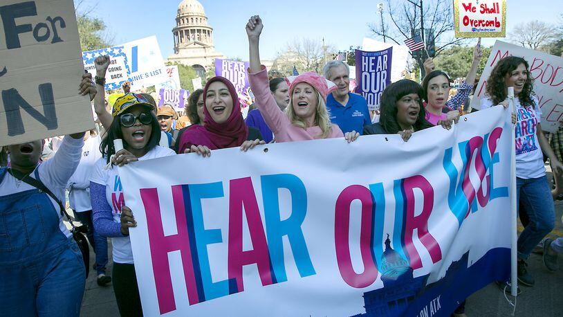 (USE THIS PHOTO LEAD) Former Texas State Senator Wendy Davis, center dressed infall pink, leads the women’s movement as thousands attended the Women’s March on Austin Saturday afternoon January 21, 2017, joining other movements across the country to stands up for women’s rights. RALPH BARRERA/AMERICAN-STATESMAN