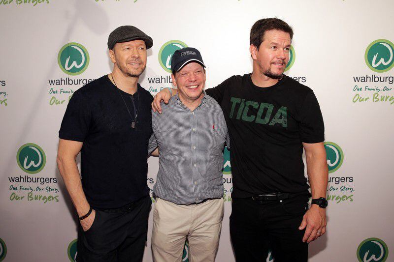  Wahlburgers has opened its first location in Georgia at The Battery at SunTrust Park. Donnie Wahlberg, Paul Wahlberg and Mark Wahlberg attend the Wahlburgers Coney Island Preview Party on June 23, 2015 in the Brooklyn Borough of New York City. (Photo by Neilson Barnard/Getty Images for Wahlburgers).