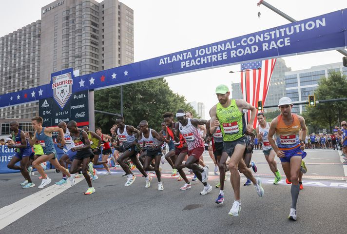Runners in the Elite Men's division take off at the 53rd running of the Atlanta Journal-Constitution Peachtree Road Race in Atlanta on Monday, July 4, 2022. (Jason Getz / Jason.Getz@ajc.com)