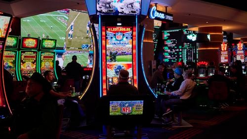 FILE — Patrons gamble on an NFL-themed gaming machine at the Circa Resort & Casino, in Las Vegas, Dec. 17, 2023.   (Bridget Bennett/The New York Times)